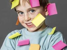 Photo of boy with sticky notes on him