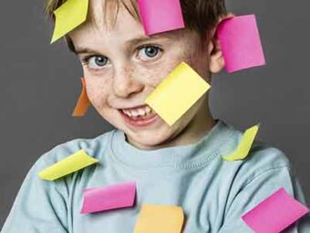 Photo of boy with sticky notes on him